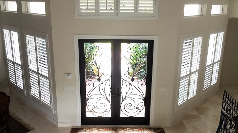 Dallas foyer with glass doors and interior shutters